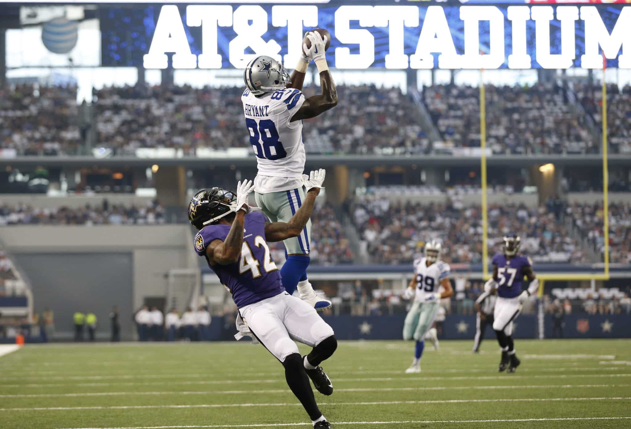 Aug 16, 2014; Arlington, TX, USA; Dallas Cowboys receiver Dez Bryant (88) catches a touchdown pass in the first quarter against Baltimore Ravens cornerback Dominque Franks (42) at AT&amp;T Stadium. Mandatory Credit: Matthew Emmons-USA TODAY Sports