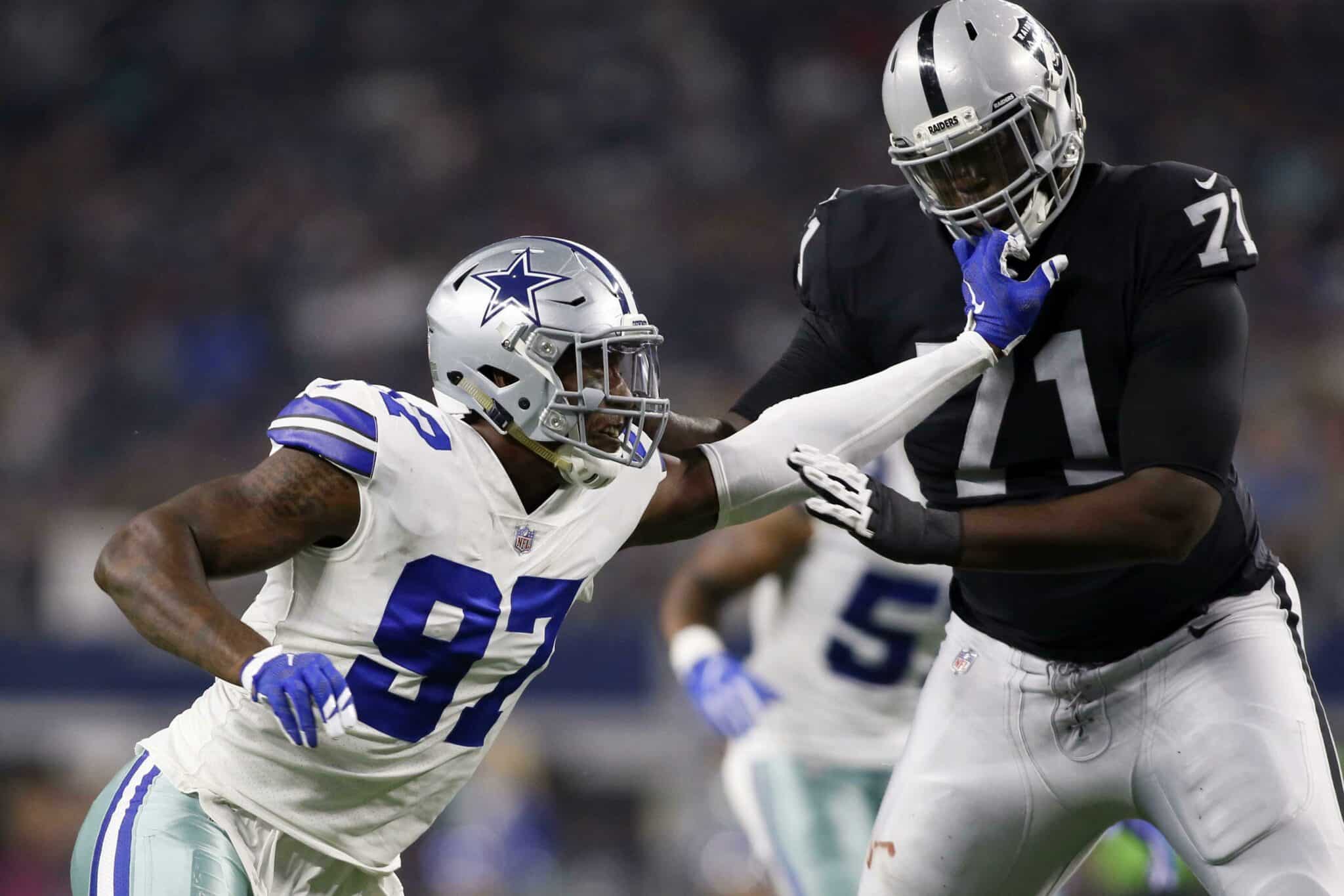 Aug 26, 2017; Arlington, TX, USA; Oakland Raiders offensive tackle David Sharpe (71) blocks Dallas Cowboys defensive end Taco Charlton (97) in the fourth quarter at AT&T Stadium. Mandatory Credit: Tim Heitman-USA TODAY Sports