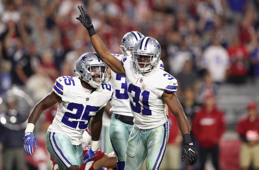 Byron Jones, Xavier Woods