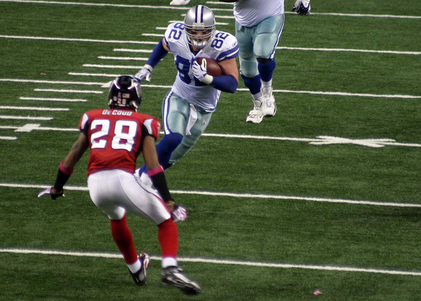 Dallas Cowboys tight end Jason Witten rumbles downfield as Atlanta's Thomas DeCoud looks to make the tackle during this October 25, 2009 contest at AT&T Stadium. Photo by Richard Paolinelli.