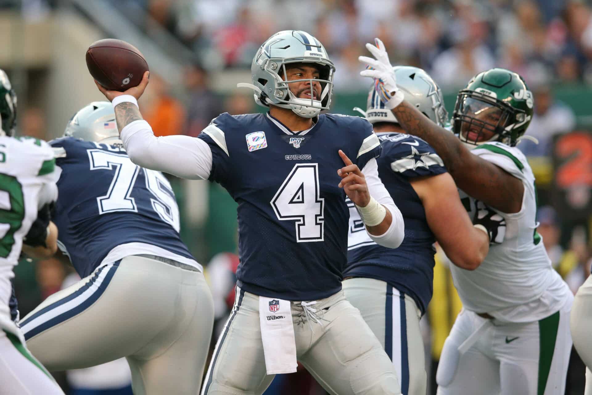 Oct 13, 2019; East Rutherford, NJ, USA; Dallas Cowboys quarterback Dak Prescott (4) throws a pass against the New York Jets during the second quarter at MetLife Stadium. Mandatory Credit: Brad Penner-USA TODAY Sports