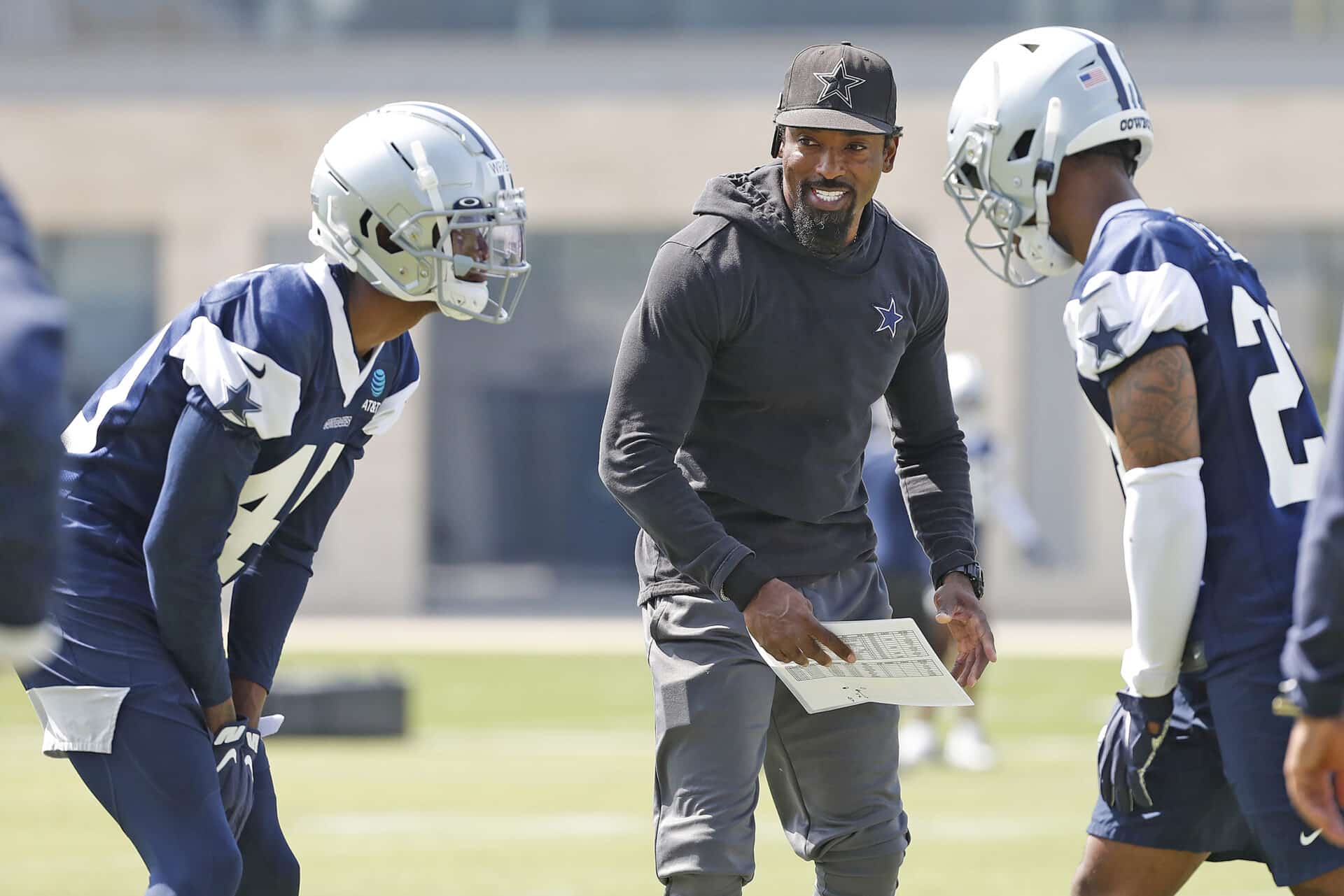 Dallas Cowboys defensive backs coach Al Harris (center) talks with Anthony Wright (40) and Kelvin Joseph (24) during the team's NFL football rookie minicamp Saturday, May 15, 2021 in Frisco, Texas. (James D. Smith via AP)