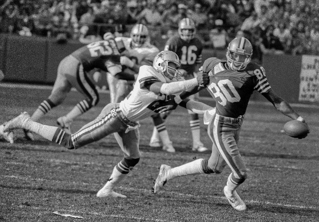 Victor Scott tackles 49ers receiver Jerry Rice during a 31-16 loss to San Francisco at Candlestick Park on Dec. 22, 1985. Photo courtesy of Al Golub/Golub Photography - www.golubphoto.com