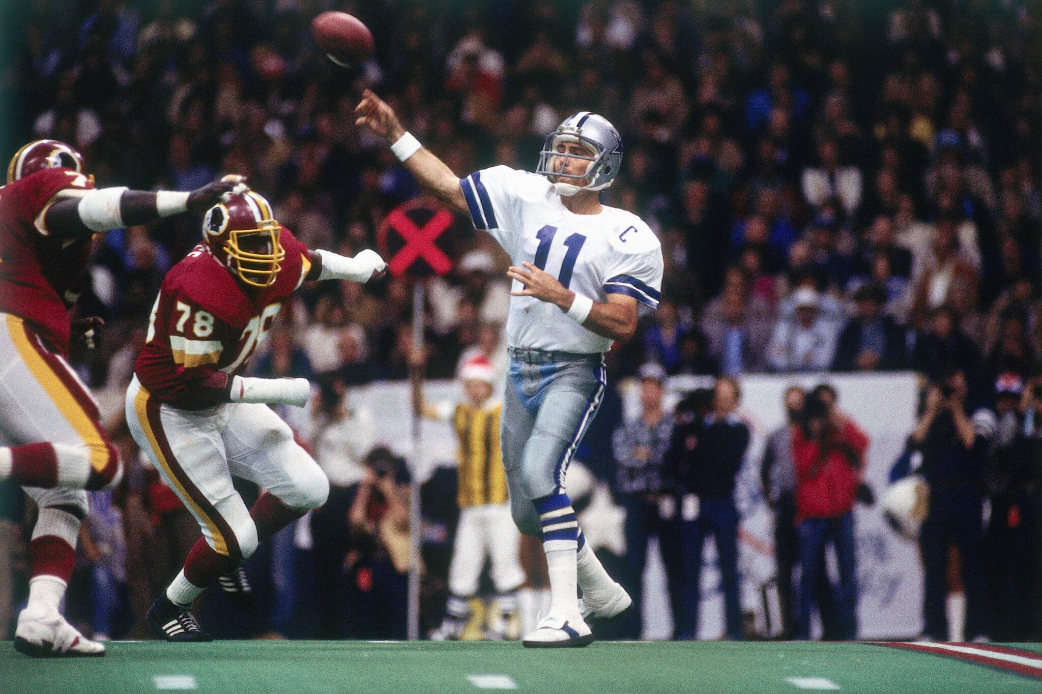 IRVING, TX - DECEMBER 11: Quarterback Danny White #11 of the Dallas Cowboys passing in a game against the Washington Redskins on December 11, l983 in Irving, Texas. (Photo by Ronald C. Modra/Getty Images)